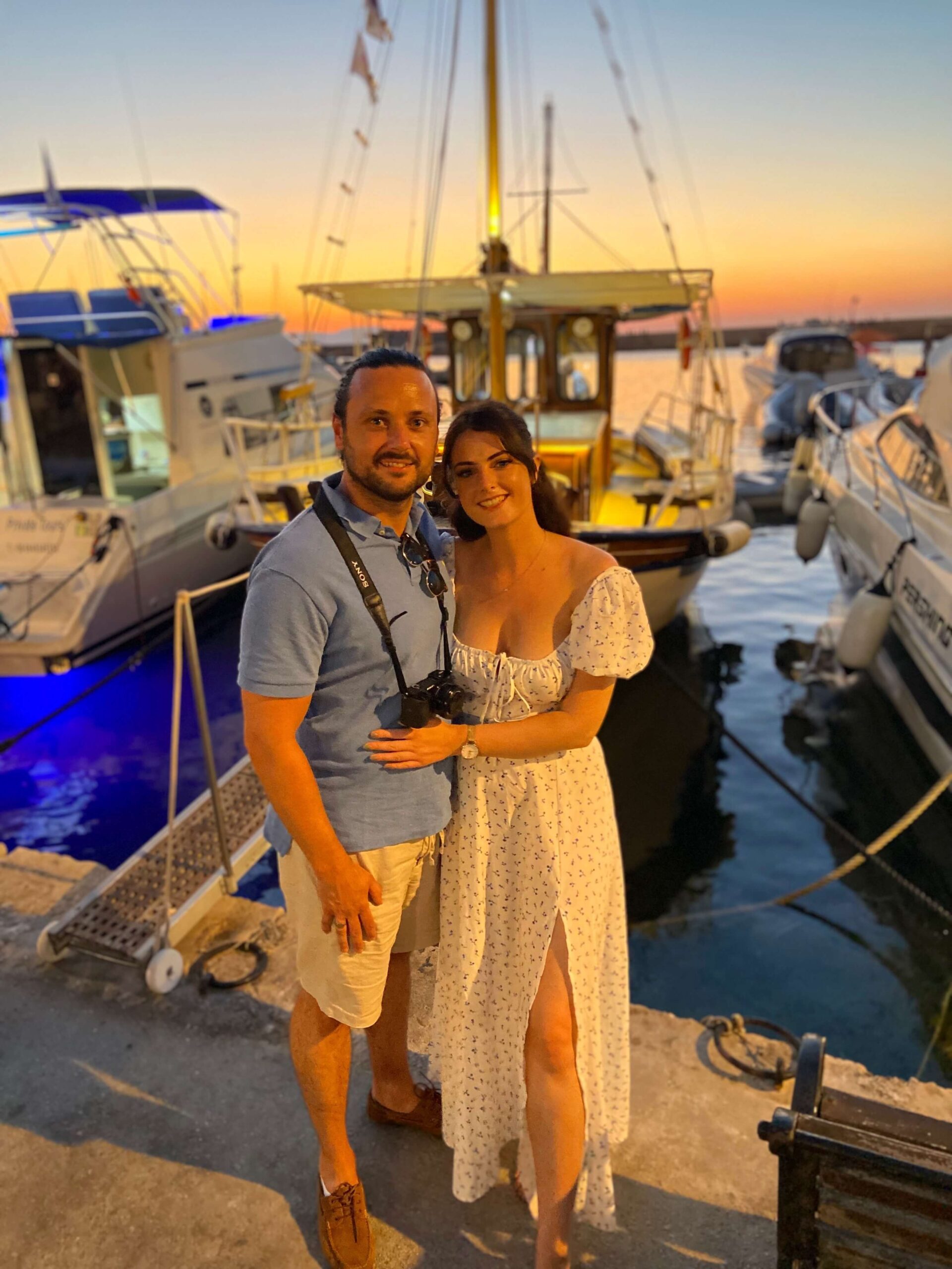 Alex & Emily in front of Manos Cruises boat after Sunset Boat Tour