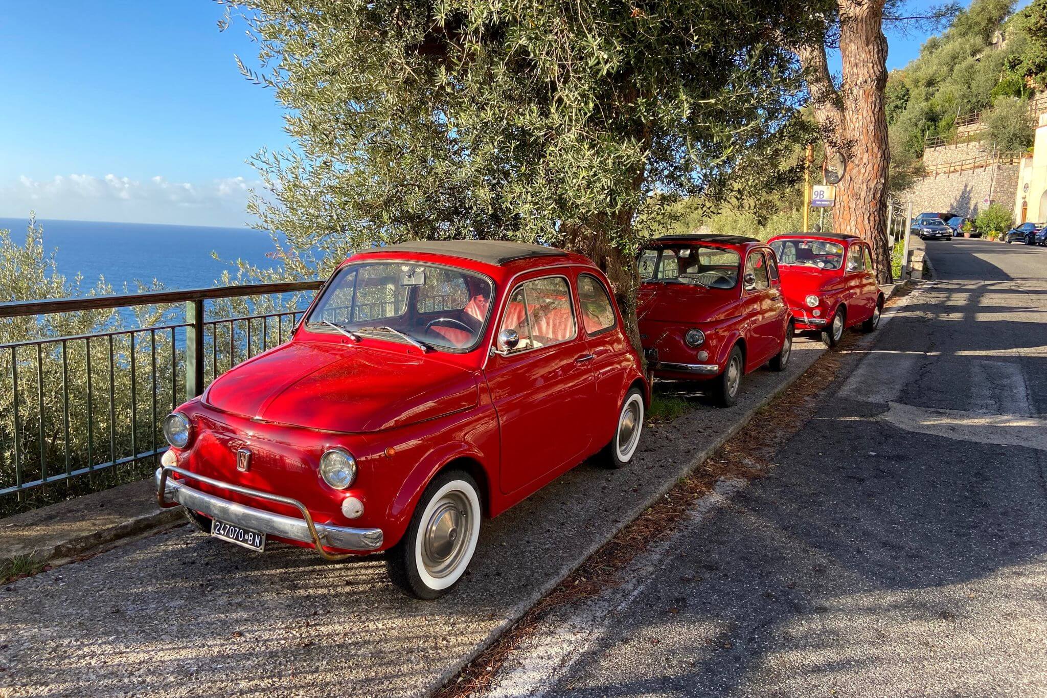 Vintage Red Fiat 500 Cars parked on the Amalfi Coast