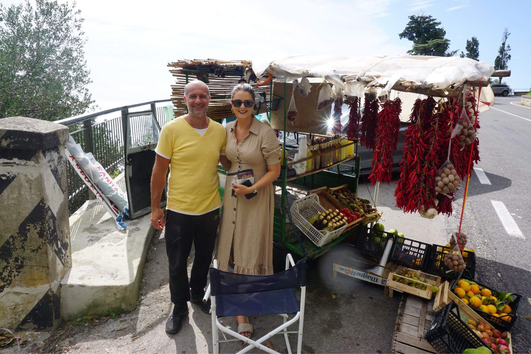 Emily with a roadside Granita di Limone seller at his roadside stall on the Amalfi Coast Road.