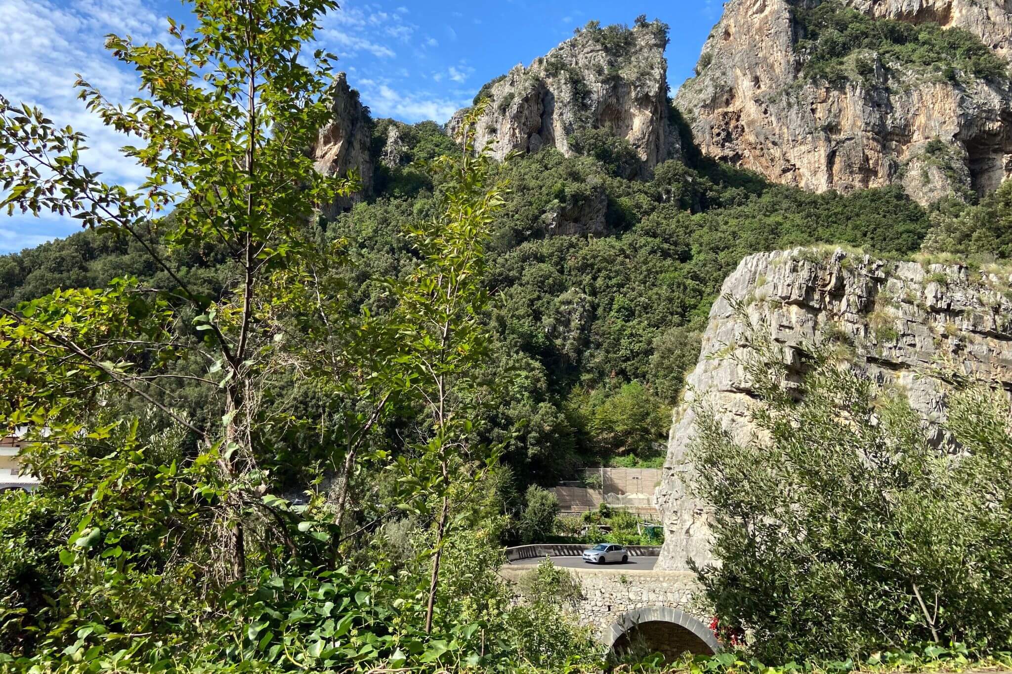 Huge cliffs tower above the SS163 Amalfi Coastal Road