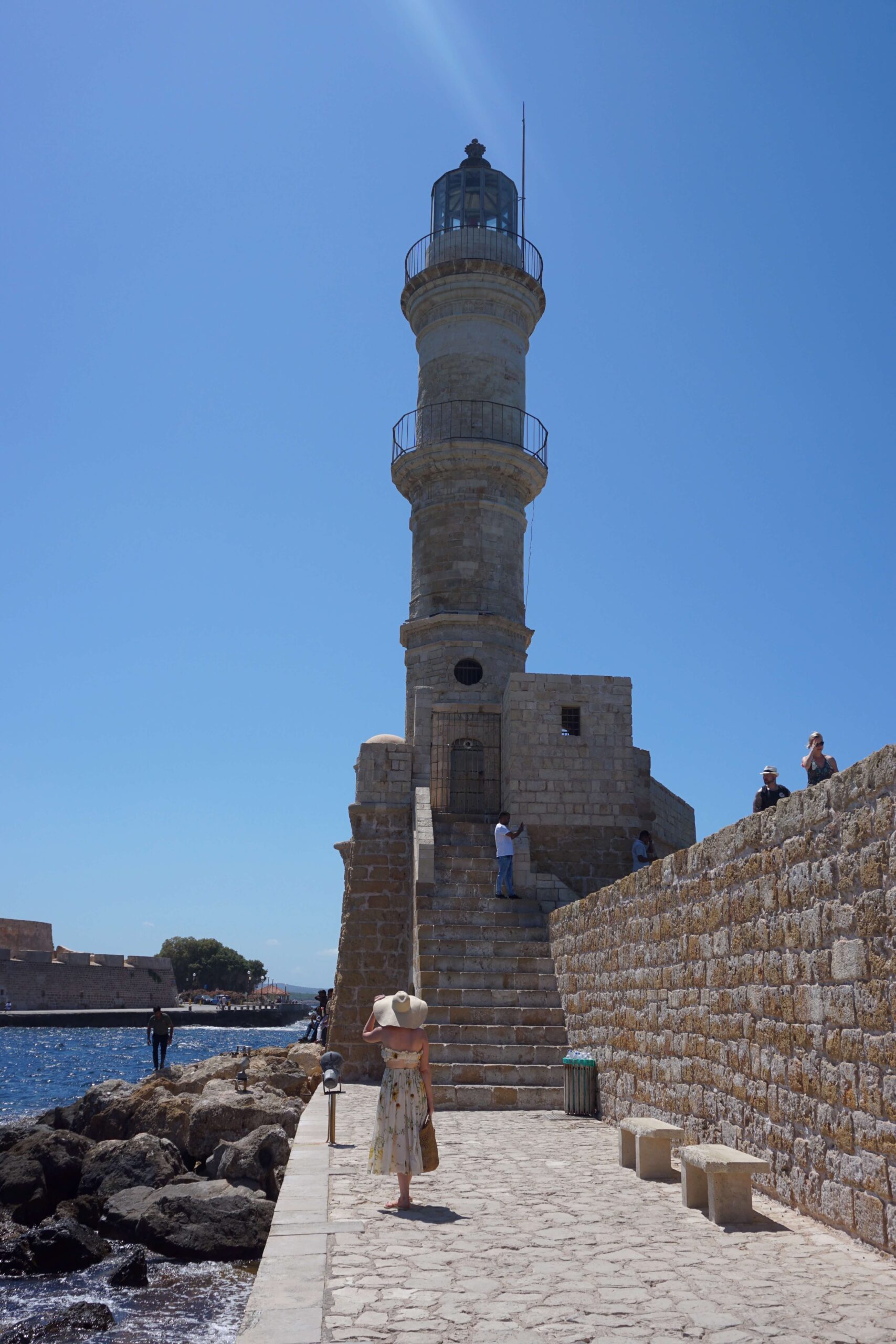 Emily walking to Chania's Old Venetian Lighthouse